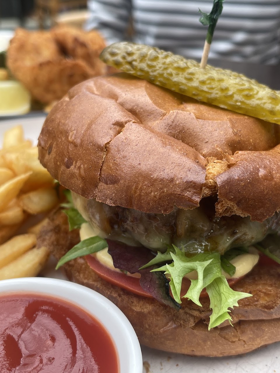 Burger with chips and sauce at Chatterbox Cafe